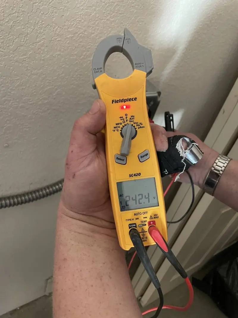 Voltage testing with clamp meter during Electrical Installation Services in Rodeo